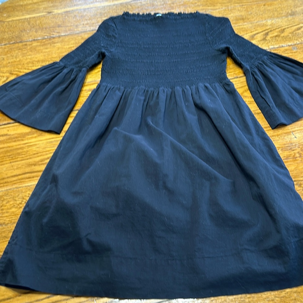 Calvin Klein black dress with bell sleeves and elastic bodice. Size 6.